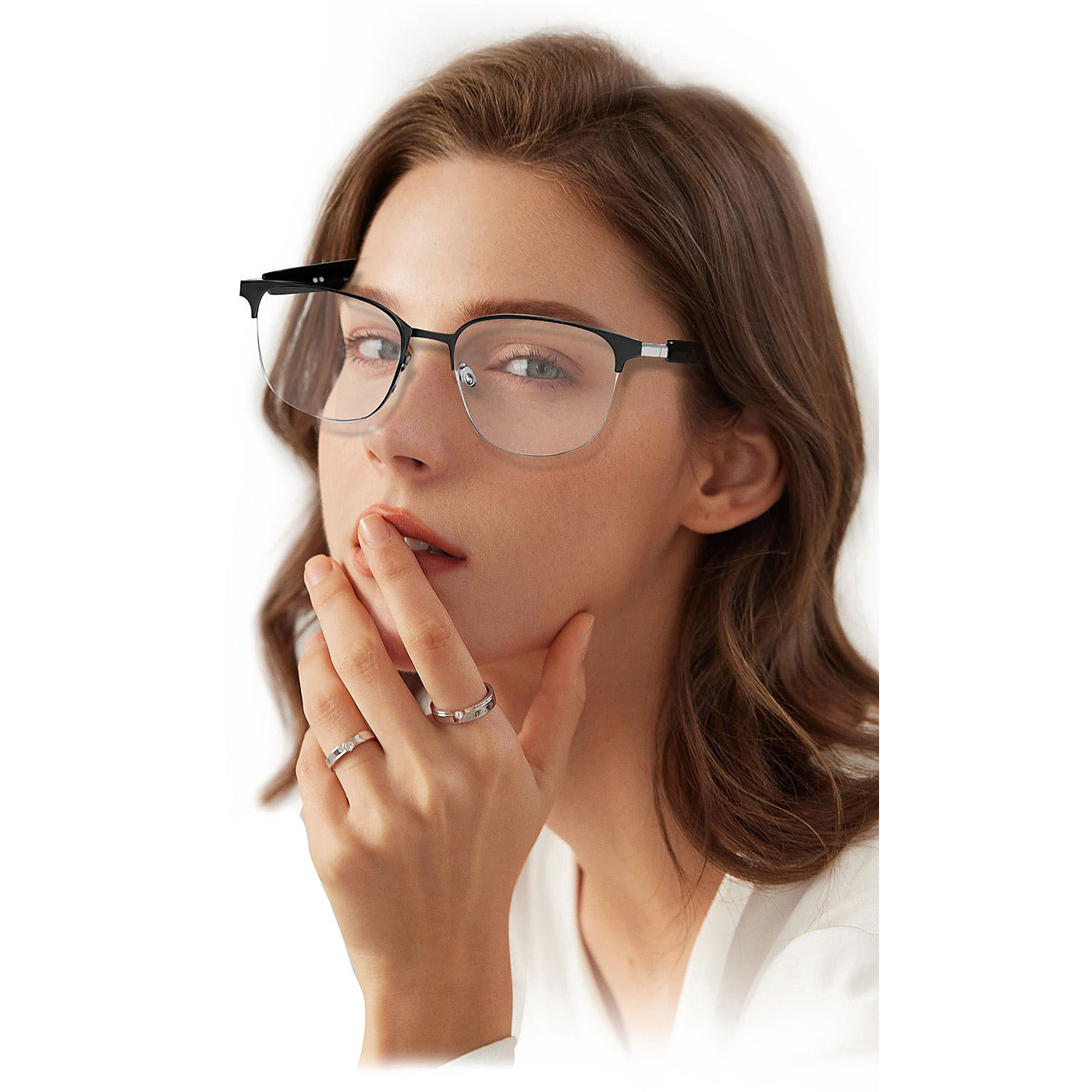 Woman wearing the silver SparkGlas frame, showing the speaker temple