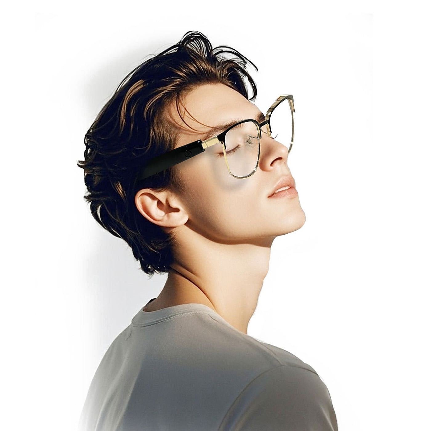 Man wearing the gold SparkGlas frame in profile, open-ear speaker visible above the ear